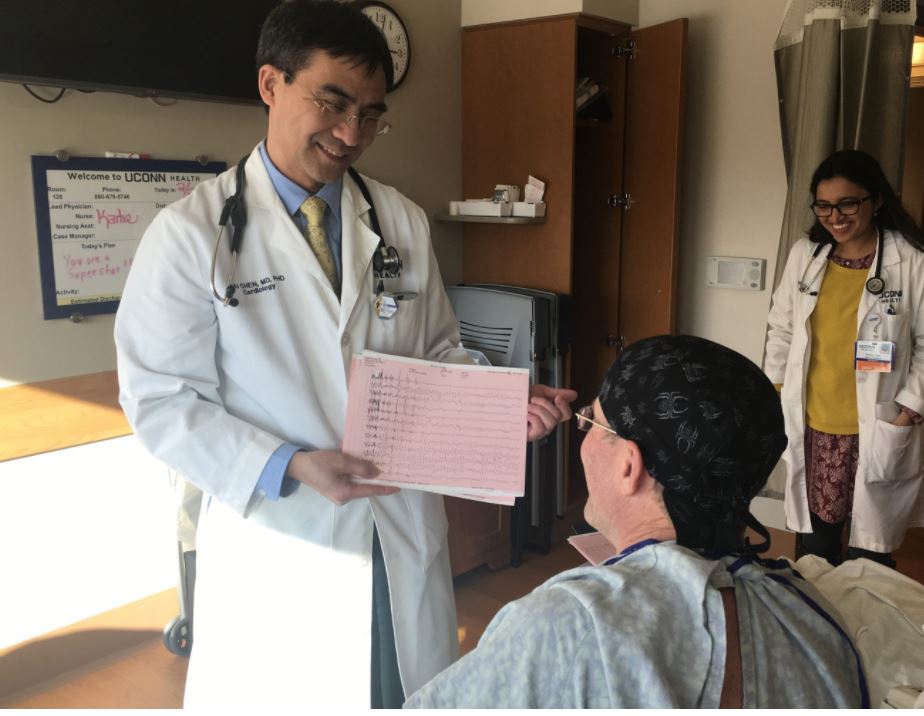 Attending cardiologist, Dr. Kai Chen, visits with his heart attack survivor patient at UConn John Dempsey Hospital (UConn Health/Lauren Woods).