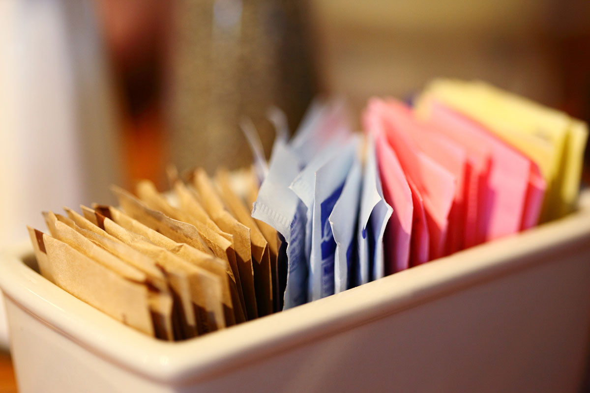 Close-Up Of Sugar And Sweetener Packets In Container At Cafe (Photo by Sharon Pruitt/EyeEm via Getty Images)