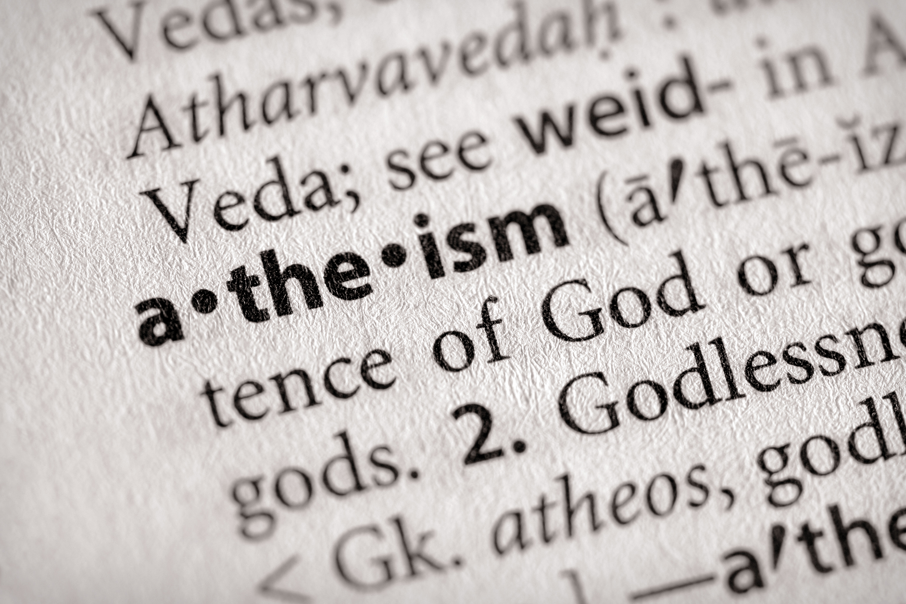 Page of a dictionary, with focus on the word 'atheism.' (Getty Images)