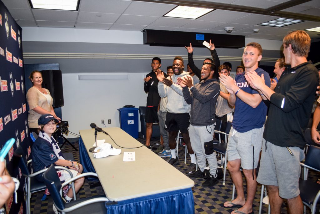 Maddox Bruening, a 13-year-old from South Glastonbury, Connecticut, was introduced as the newest member of the Husky team at a press conference that included his parents, Joey and Sherry, as well as the UConn coaching staff and team.