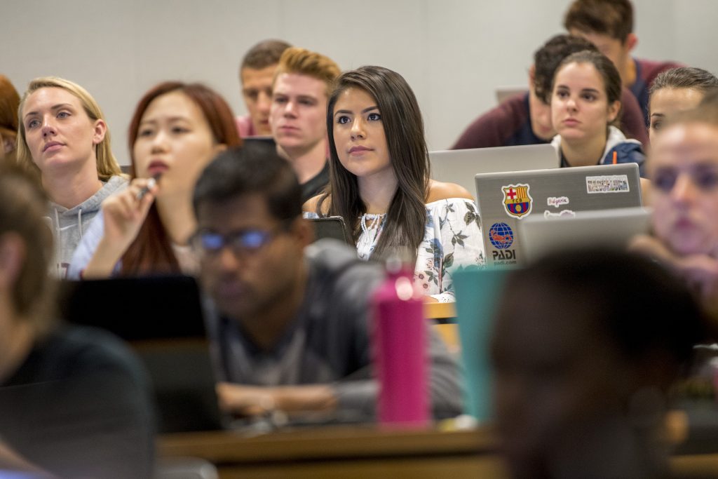 Irma Valverde ‘18 (CLAS, BUS) listens to a lecture by Professor Anna Radziwillowicz in the School of Business. (Sean Flynn/UConn Photo)