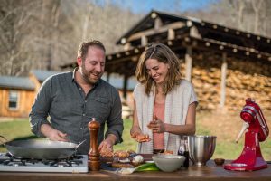 In Asheville, North Carolina, Joel Gamoran and local celebrity chef Katie Button put together an outdoor dinner feast, using out-of-the-box local ingredients consisting of food that usually gets trashed. The pair gather discarded spent grain from a local craft brewery to make incredibly savory biscuits, as well as using caul fat, adding intense flavor to chorizo.