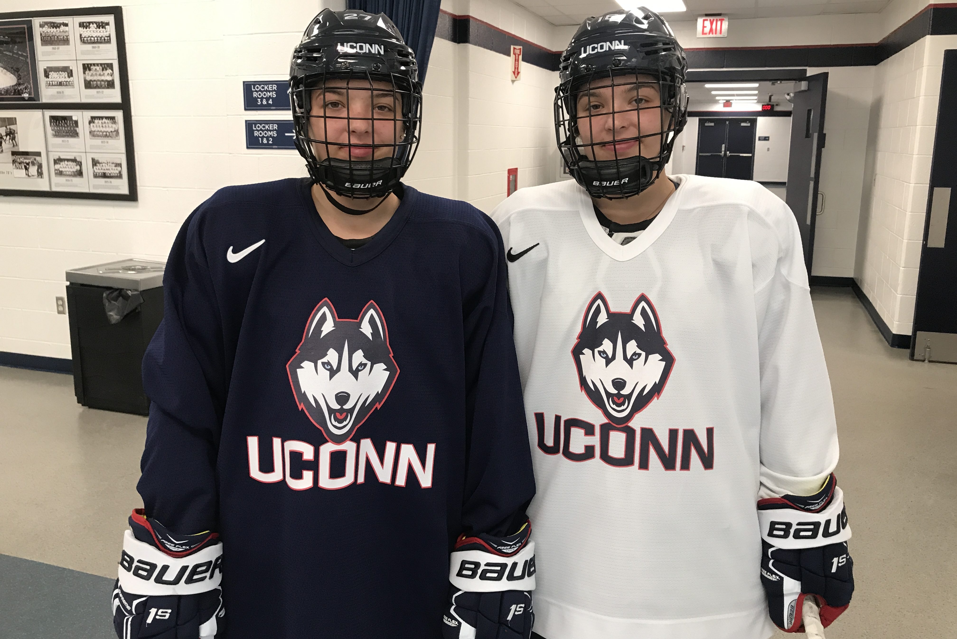 Freshmen Morgan, left, a forward, and Taylor Wabick, a defender, at the Freitas Ice Forum. 'We have always been on the same team, except for one game,' says Taylor. (Steve Lewis/UConn Photo)