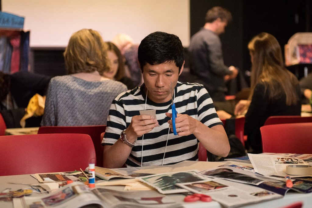 To spur creativity during the closing session, conference participants were given minimal resources such as old magazines and cardboard boxes, with which they created "toy theatres" at the Ballard Puppetry Museum. (Devin Basdekian/UConn School of Business)