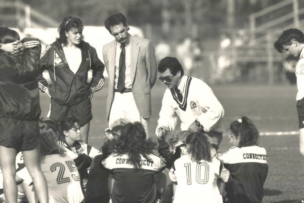 Women's Soccer Coach Len Tsantiris talks to the team in 1984.