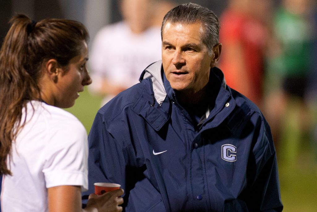 Women's Soccer Coach Len Tsantiris talks to Danielle Schulmann in 2012. (Stephen Slade '89 (SFA) for UConn)