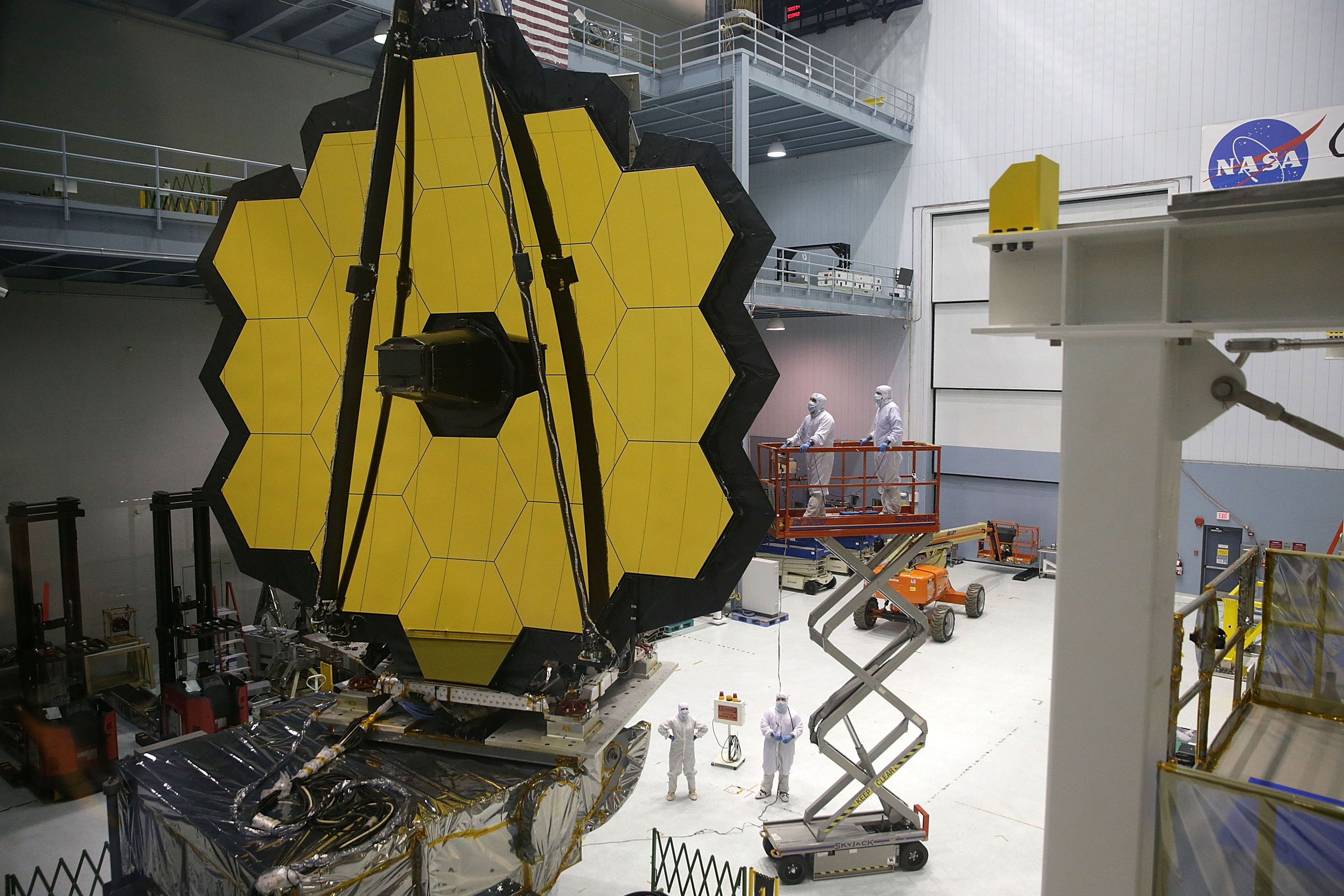 Engineers and technicians assemble the James Webb Space Telescope on Nov. 2, 2016 at NASA's Goddard Space Flight Center in Greenbelt, Maryland. The telescope, designed to be a large space-based observatory optimized for infrared wavelengths, will be the successor to the Hubble Space Telescope and the Spitzer Space Telescope. (Photo by Alex Wong/Getty Images)