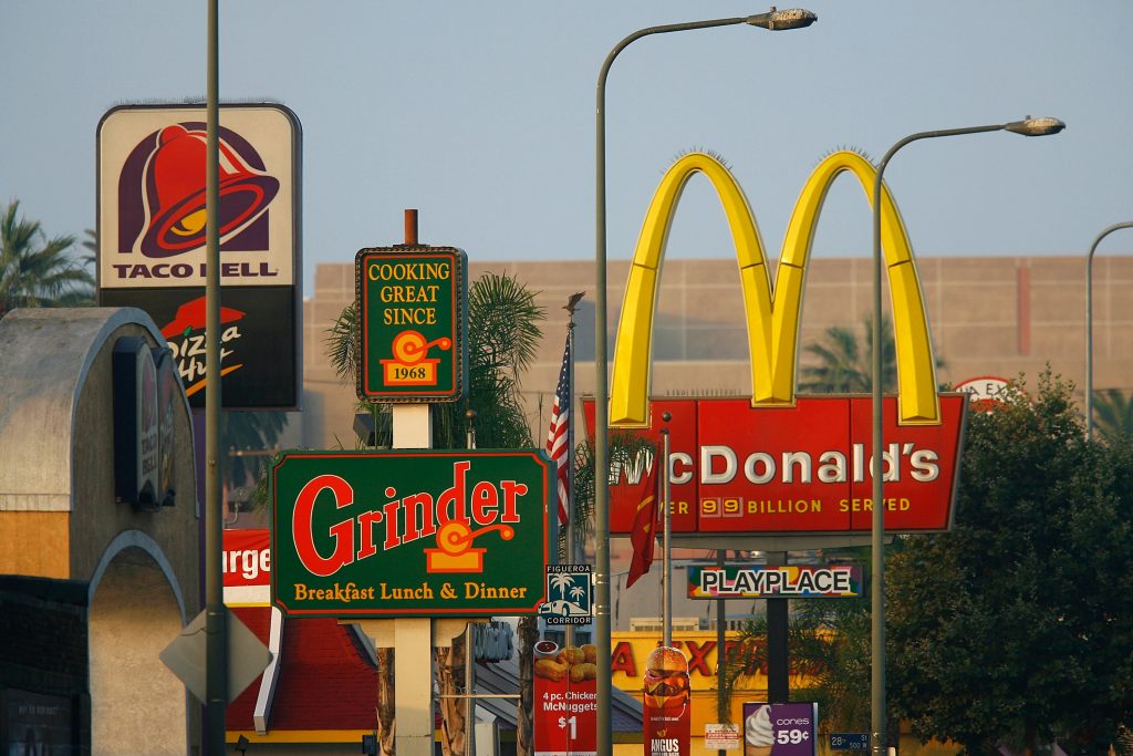 Fast food restaurants thrive in one of the poorest areas of Los Angeles. South LA has the highest concentration of fast-food restaurants of the city, about 400, and only a few grocery stores. (Photo by David McNew/Getty Images)