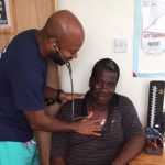 UConn Health's Dr. Hynes Birmingham works with a patient in Dominica after Hurricane Maria. (Photo courtesy of Dr. Birmingham)