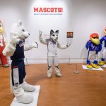 Jonathan the Husky, UConn's current mascot visits the exhibit 'Mascots! Mask Performance in the 21st Century' at the Ballard Institute and Museum of Puppetry. (Peter Morenus/UConn Photo)