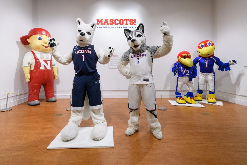 Jonathan the Husky, UConn's current mascot visits the exhibit 'Mascots! Mask Performance in the 21st Century' at the Ballard Institute and Museum of Puppetry on Oct. 30, 2017. (Peter Morenus/UConn Photo)