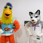 Jonathan the Husky, UConn's current mascot, right, poses with the Famous San Diego Chicken. (Peter Morenus/UConn Photo)