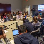 Cynthia DeRoma, an adjunct English faculty member, leads a discussion on a recent viral video and issues of diversity in primary education during a UConn Metanoia event titled 'Who Are the Trolls Really Trolling?' (Peter Morenus/UConn Photo)