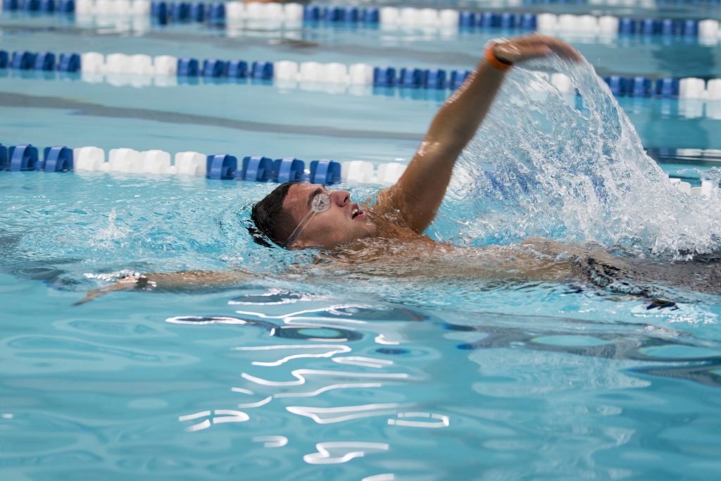 Daniel Munch ‘19, Livestock Management and Policy (Individualized Major); Resource Economics who is also a "Day in the Life" student swims laps at the Brundage pool on Sept. 6, 2017. (Sean Flynn/UConn Photo)