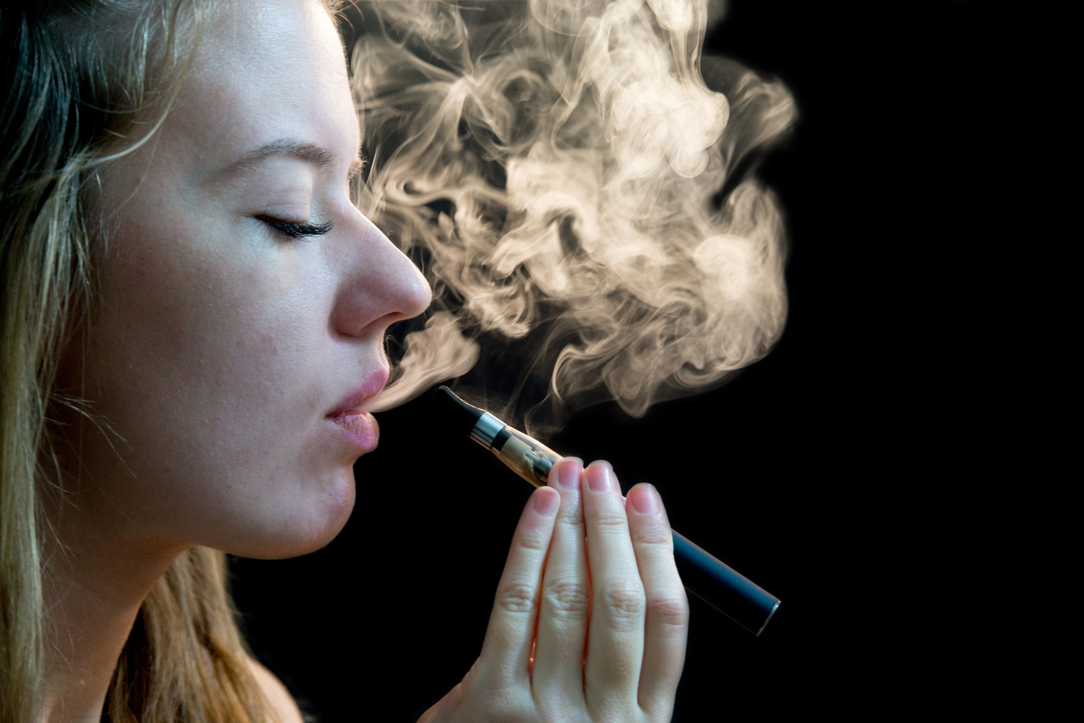 Woman inhaling from an electronic cigarette. (Getty Images)