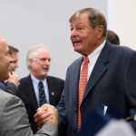 Peter J. Werth, right, shakes hands with David Benedict, director of UConn Athletics,  following an event to announce a $22.5 million commitment to the University and the naming of the Peter J. Werth Residence Tower. (Peter Morenus/UConn Photo)