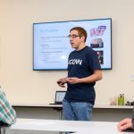 Graduate student Ryan Ouimet '14 (ENG) of MediSense explains the development of a tool to detect diabetes using the breath of a patient during the Entrepreneurial & Innovation Student Huddle. (Peter Morenus/UConn Photo)