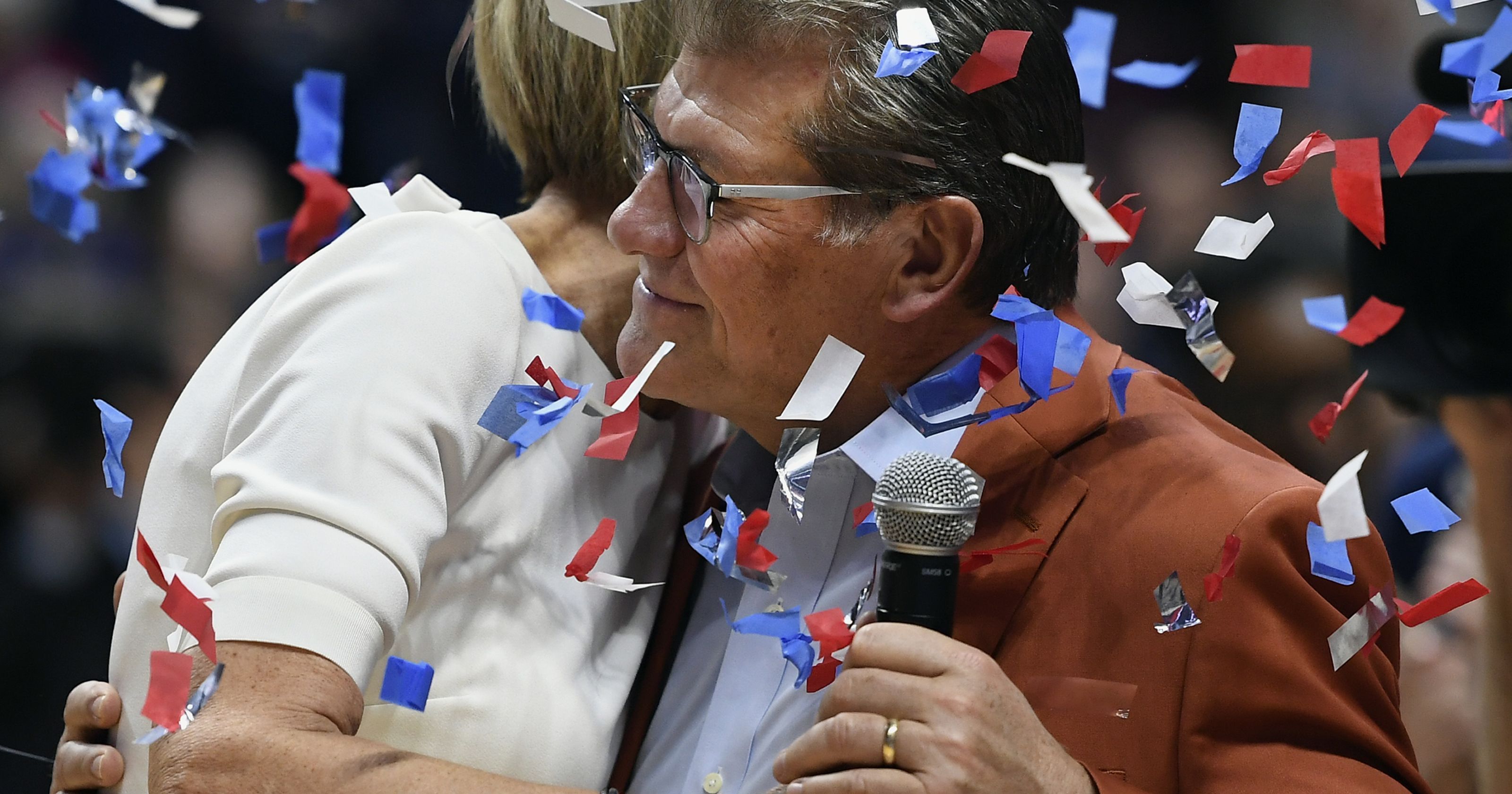 Chris Dailey and Geno Auriemma celebrate after their 1,000 win. (Associated Press)