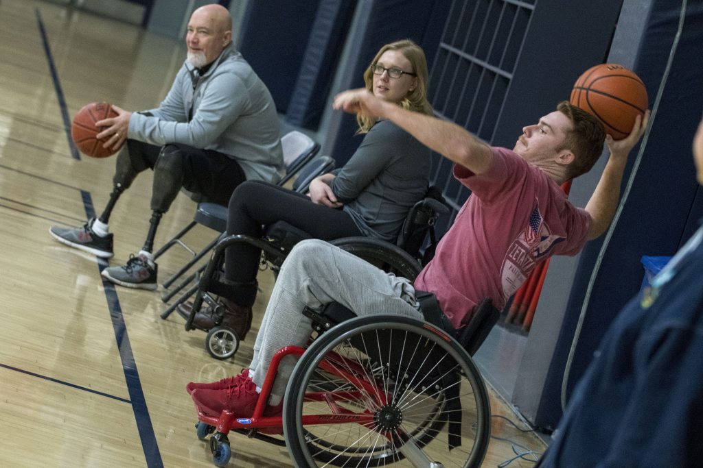 Junior Joseph De Muyt, an economics major, plays wheelchair basketball at an event organized by UConn Recreation and Husky Adapted Sport Club, with support from the Ryan Martin Foundation, on Nov. 30. (Garrett Spahn '18 (CLAS)/UConn Photo)