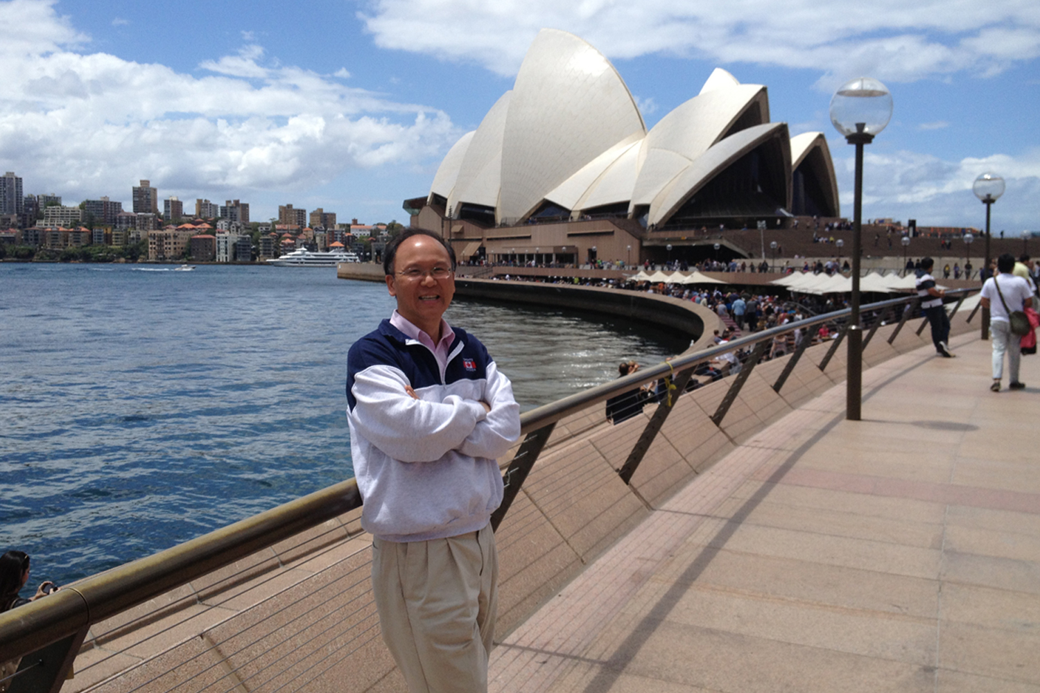 Professor of Mathematics Guozhen Lu stands in front of the Sydney Opera House