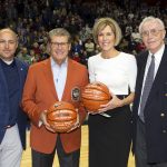 Geno Auriemma and Chris Dailey pose with Athletics Director David Benedict, far left, and former Men's Basketball head coach Dee Rowe, far right, as they celebrate their 1,000th win.