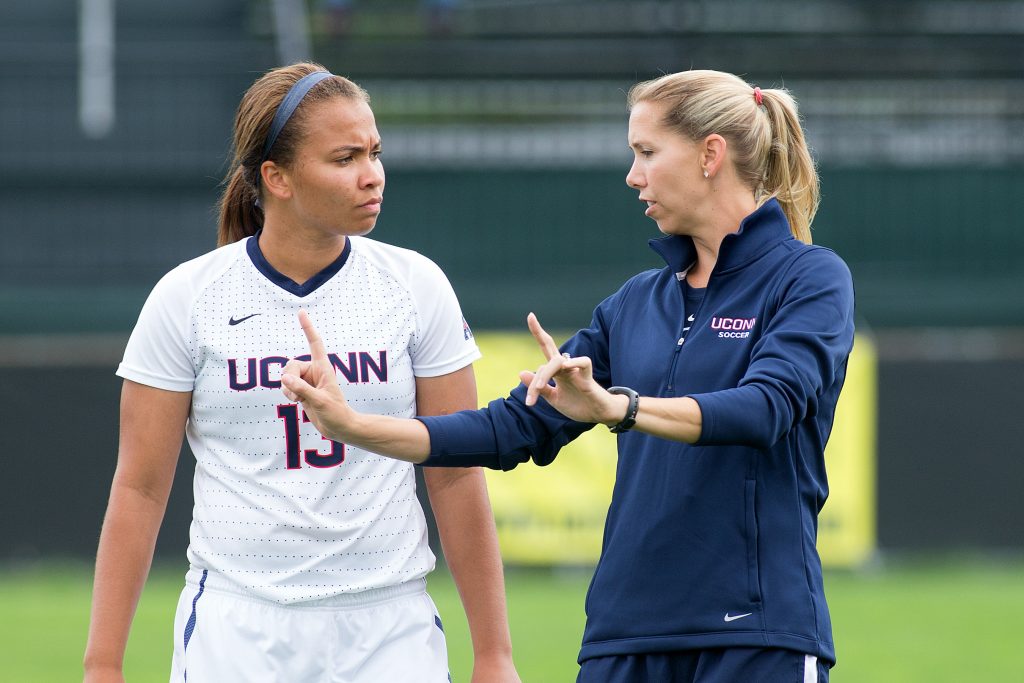 Margaret (Tietjen) Rodriguez, new head coach of women's soccer, with player Toriana Patterson. (Stephen Slade '89 (SFA) for UConn)