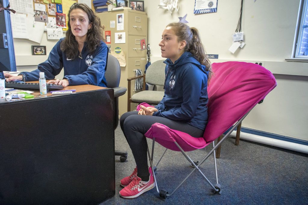 Student-athlete Courtney Akerley ‘19 (CLAS) meets with her academic adviser, Lindsay Darcy, in Hall Dorm. (Sean Flynn/UConn Photo)