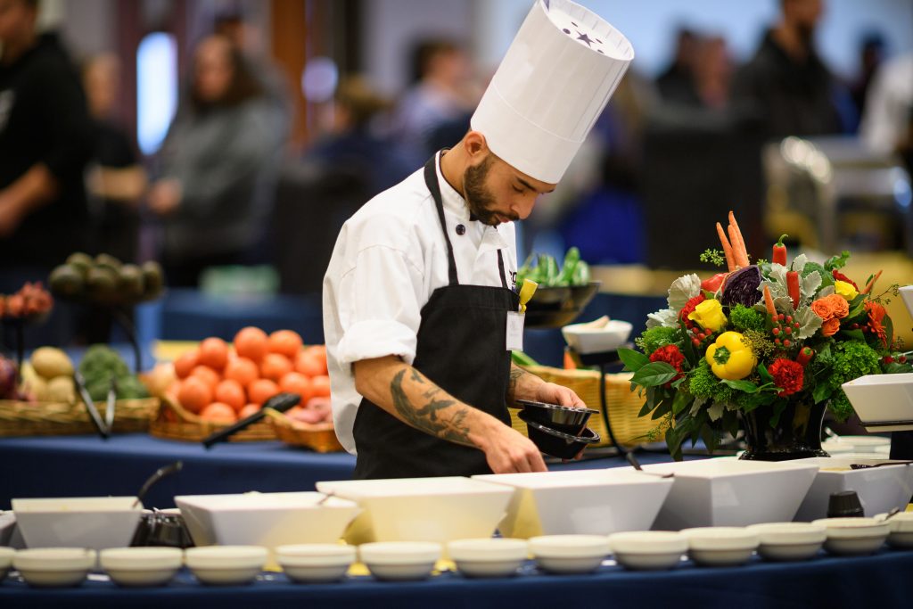 James Upright of McMahon dining collects spices during the Boiling Point competition of UConn Dining's 18th annual Culinary Competition held at Rome Ballroom onJan. 9, 2018. (Peter Morenus/UConn Photo)