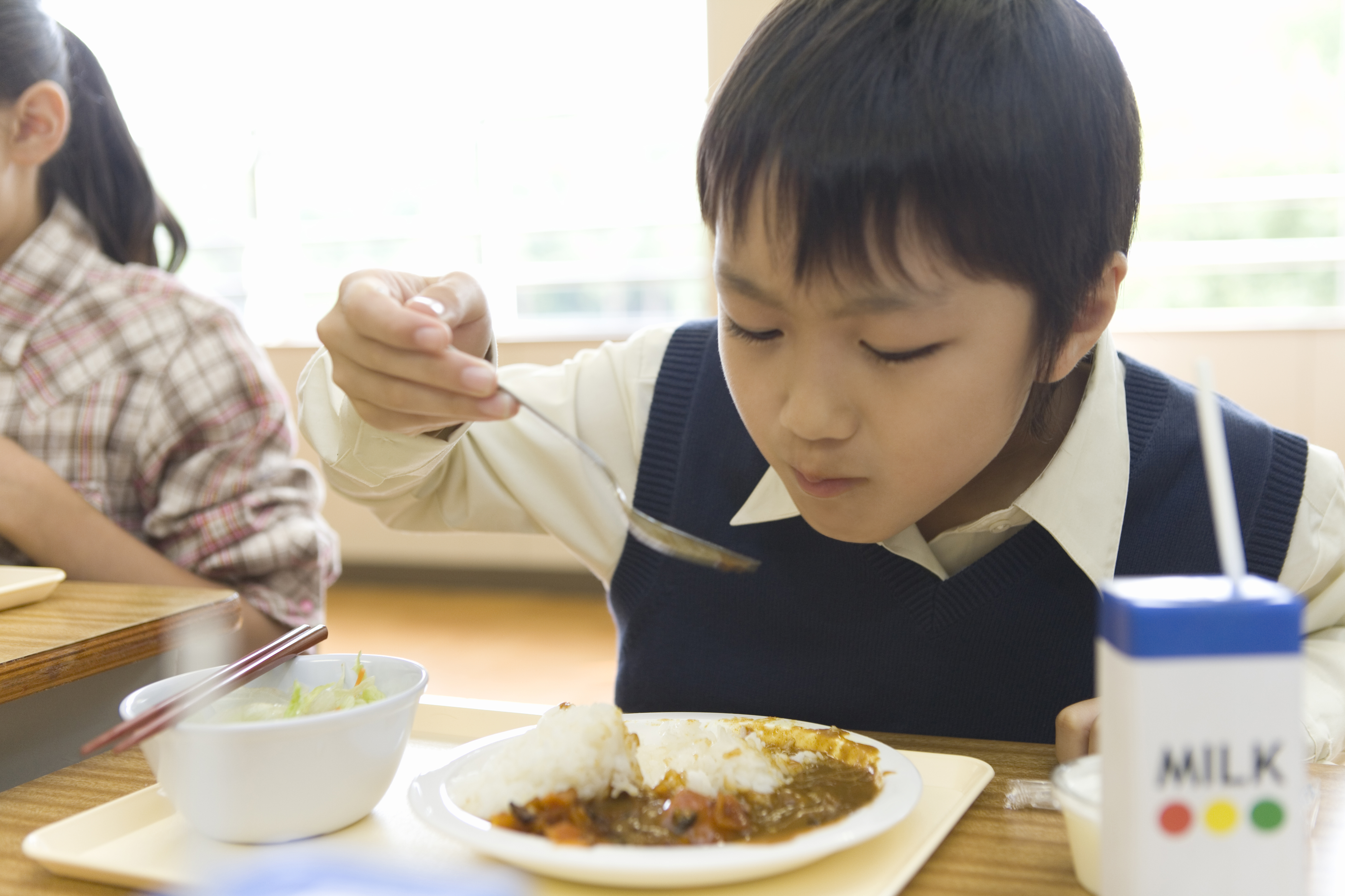 Boy eating school lunch. (Getty Image)