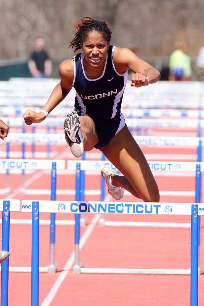 Former UConn women’s track-and-field standout Phylicia George competes in hurdles at UConn. (File photo by Stephen Slade '89 (SFA) for UConn)