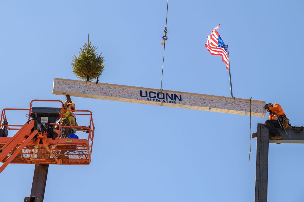 UConn marked a milestone in the construction of the new recreation center, as the final beam was hoisted into place. (Peter Morenus/UConn Photo)