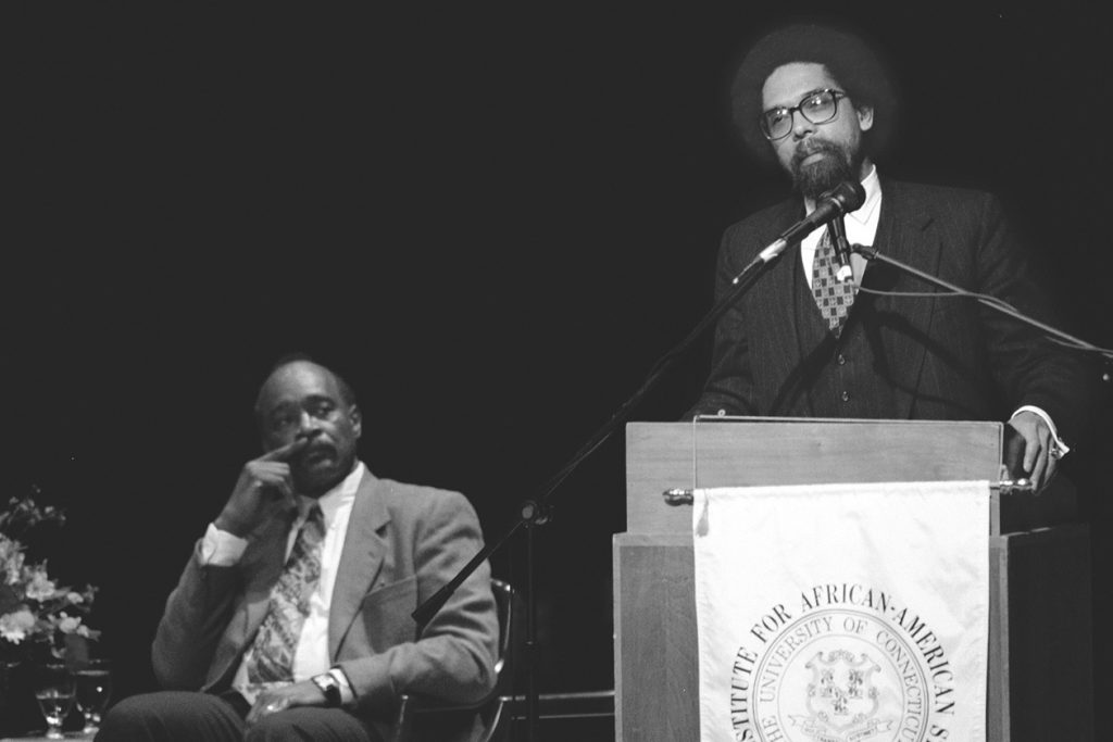 Philosopher Cornel West spoke at UConn in 1996 about racism in society. At left is Ronald Taylor, then-director of the Institute for African-American Studies. (Peter Morenus/UConn File Photo)