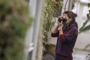Marissa Aldieri '18 (CLAS) takes photos at the UConn Biodiversity Education and Research Greenhouses.
