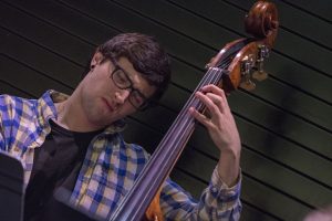 Nathan Giordano, a senior music major, plays the bass at “Jazz Night at the Ballard” on Feb. 20. (Garrett Spahn '18 (CLAS)/UConn Photo)