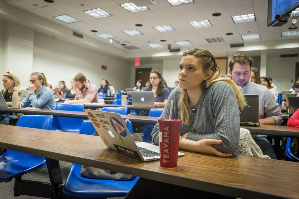 Student-athlete Monica Marcello ’18 (CAHNR) listening to a Medical Therapy Nutrition lecture by Professor Nancy Rodriguez in the Engineering II Building on Feb. 28, 2018. (Sean Flynn/UConn Photo)