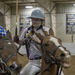 Kathleen Moriarty '19 (CAHNR), an allied health major, competes with an opponent from the Kentucky team during the polo match on Feb. 3, 2018. (Garrett Spahn '18 (CLAS)/UConn Photo)