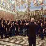 The Concert Choir, led by Jamie Spillane, sings at the Sistine Chapel under Michelangelo’s most famous painting.