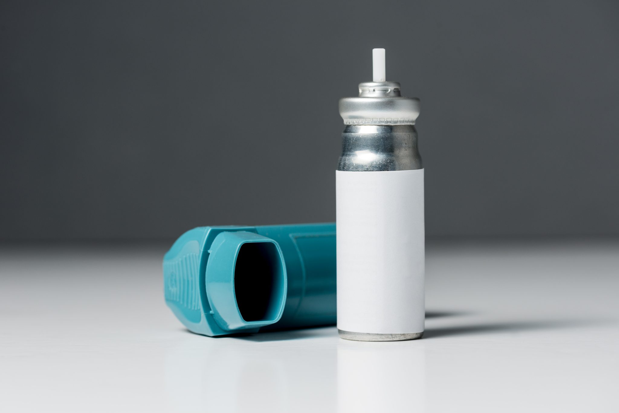 Asthma inhaler and a pressurised gas cannister refill. (Getty Image)