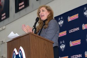 President Susan Herbst welcomes Dan Hurley to the podium during a welcome event for the press and the university community to meet him.