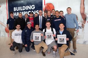 A group of student season-ticket holders who waited to meet Coach Hurley after the press conference and get autographs, mainly on the Daily Campus page announcing his appointment.