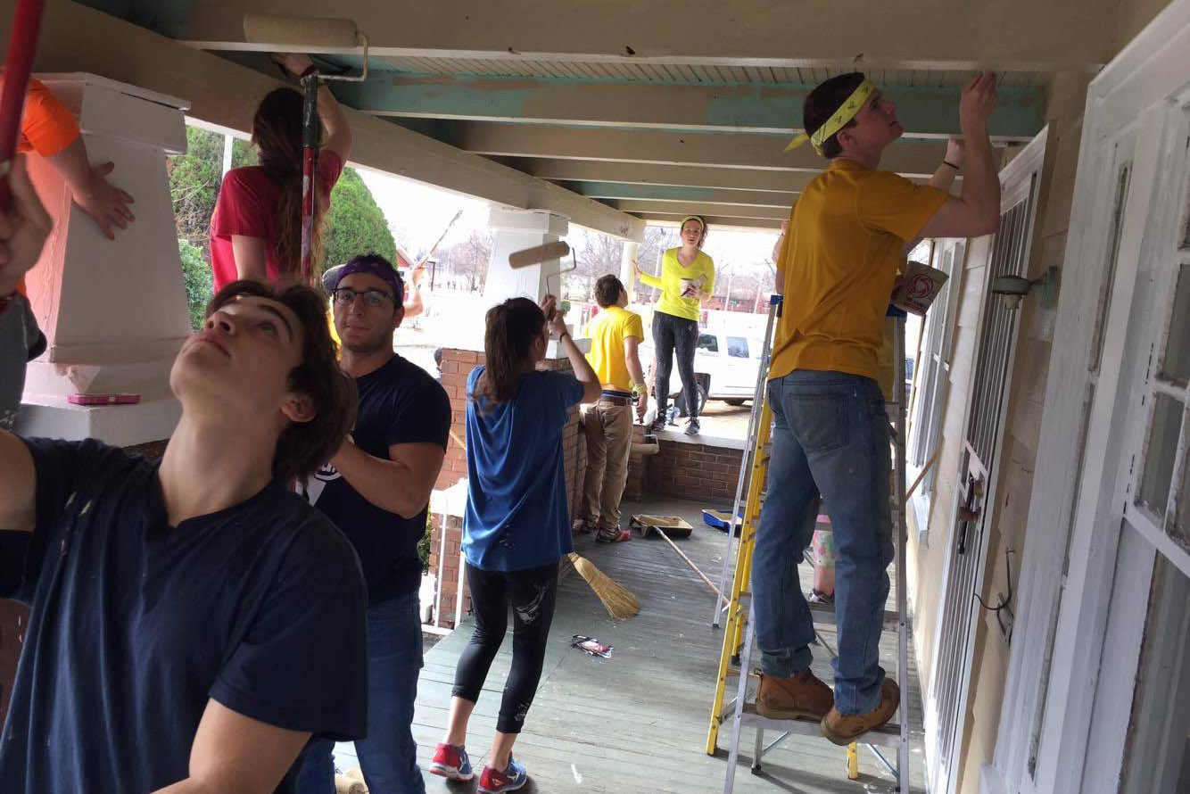 UConn students on an Alternative Break trip to Birmingham, Alabama, help fix up a house in a low-income neighborhood. (Community Outreach/UConn Photo)