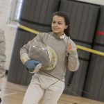 Michelle Martinez '21 (CAHNR), an animal science major, prepares for practice on March 4. The first hour of practice is spent working on fundamentals, like footwork and blade work, while the last hour is pure fencing. (Garrett Spahn '18 (CLAS)/UConn Photo)