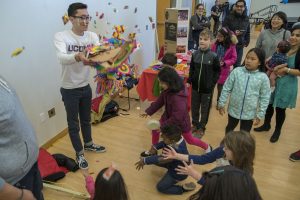 Brandon Lira, a sophomore political science major, demonstrates a piñata provided by the Mexican Student Association at Worldfest. (Garrett Spahn ’18 (CLAS)/UConn Photo)