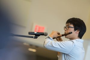 Qian Xu of the Chinese Student and Scholar Association plays a wind instrument at Worldfest. (Garrett Spahn ’18 (CLAS)/UConn Photo)