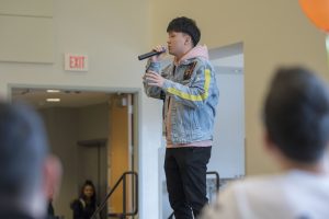 Hanwei Liu of the Chinese Students and Scholars Association sings a song about what it's like to miss your homeland. (Garrett Spahn ’18 (CLAS)/UConn Photo)