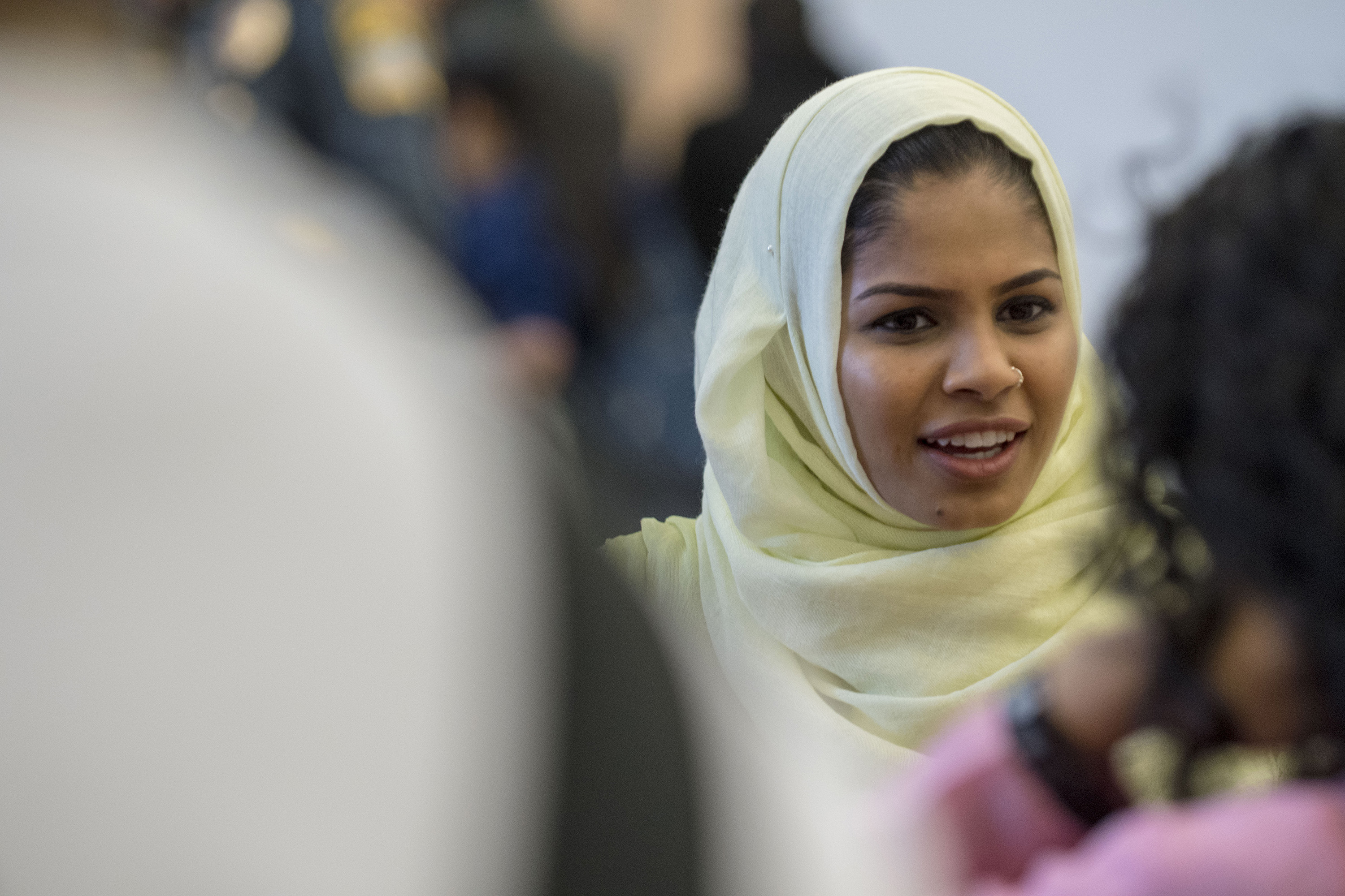 Roushan Ahmed, a senior history major and member of the Bangladesh Students Association, speaks to students at their booth in the Student Union Ballroom on March 25, 2018. (Garrett Spahn '18 (CLAS)/UConn Photo)