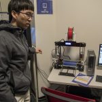 Nathan Hom '19 (ENG/BUS), a junior majoring in management and manufacturing engineering, creating a 1.5 inch by 1.5 inch block on a 3-D printer in the OPIM Innovate Lab. The process begins with making a 3-D model, either through a modeling software or by scanning an object. (Garrett Spahn '18 (CLAS)/UConn Photo)