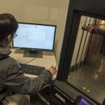 Nathan Hom '19 (ENG/BUS) creating a 1.5 inch by 1.5 inch block in the OPIM Innovate Lab using a program called Solid Works. (Garrett Spahn '18 (CLAS)/UConn Photo)