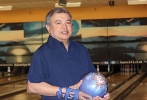 Rings signifying one of Chung's perfect games and his induction into the Southeastern Connecticut Bowling Hall of Fame. (Sheila Foran/UConn Photo)