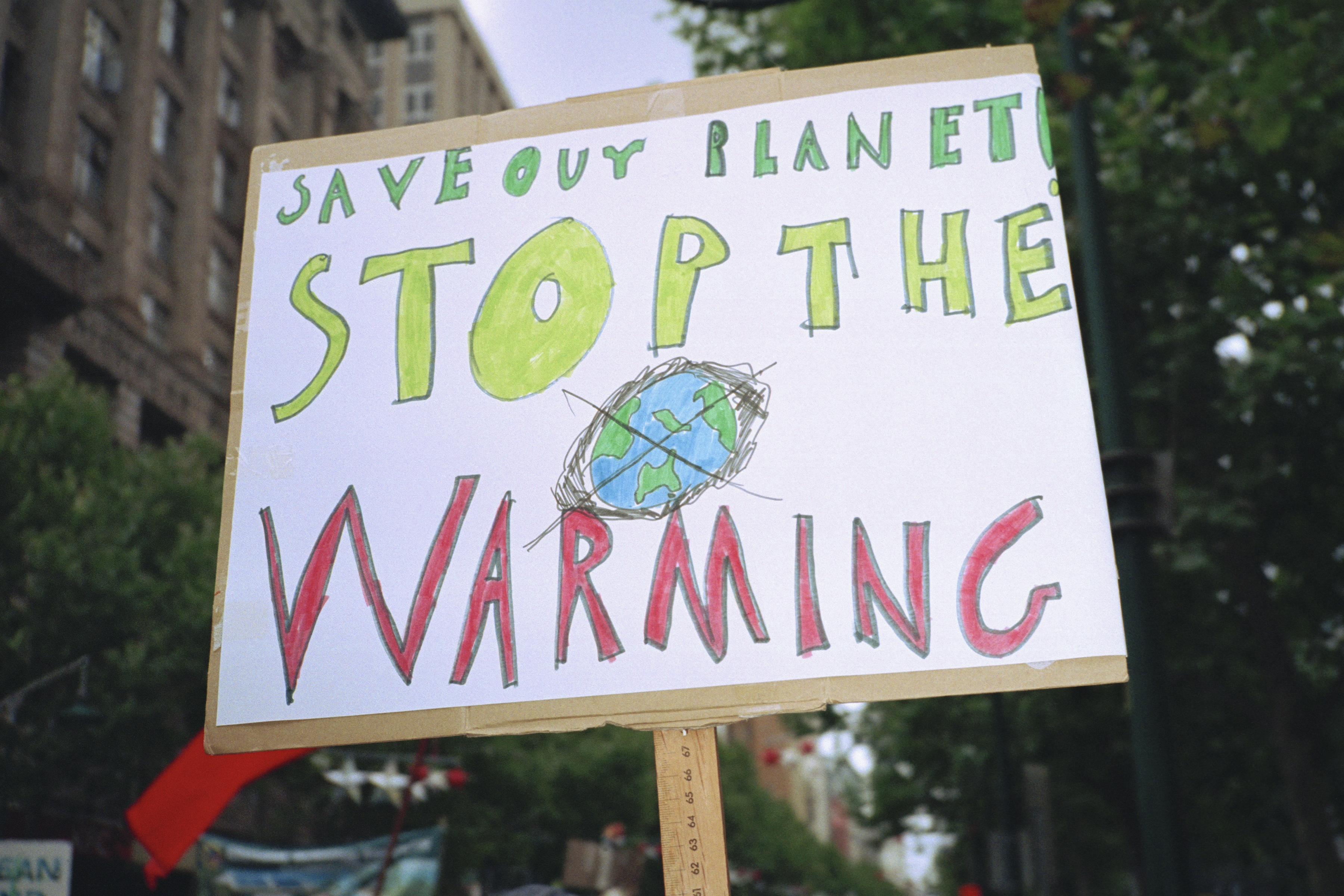 A global warming placard on display in a city. (Getty Images)